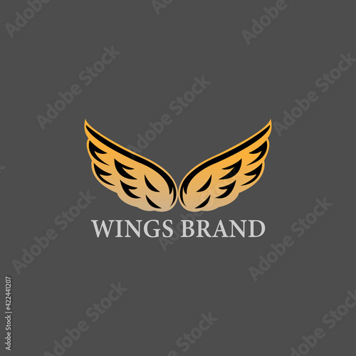 Vector graphics of abstract wing symbol for your company with gold sample text