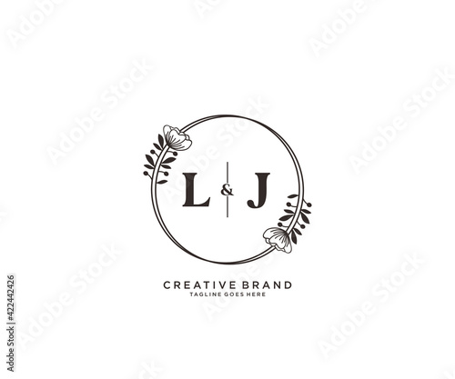 initial LJ letters hand drawn feminine and floral botanical logo suitable for spa salon skin hair beauty boutique and cosmetic company. photo