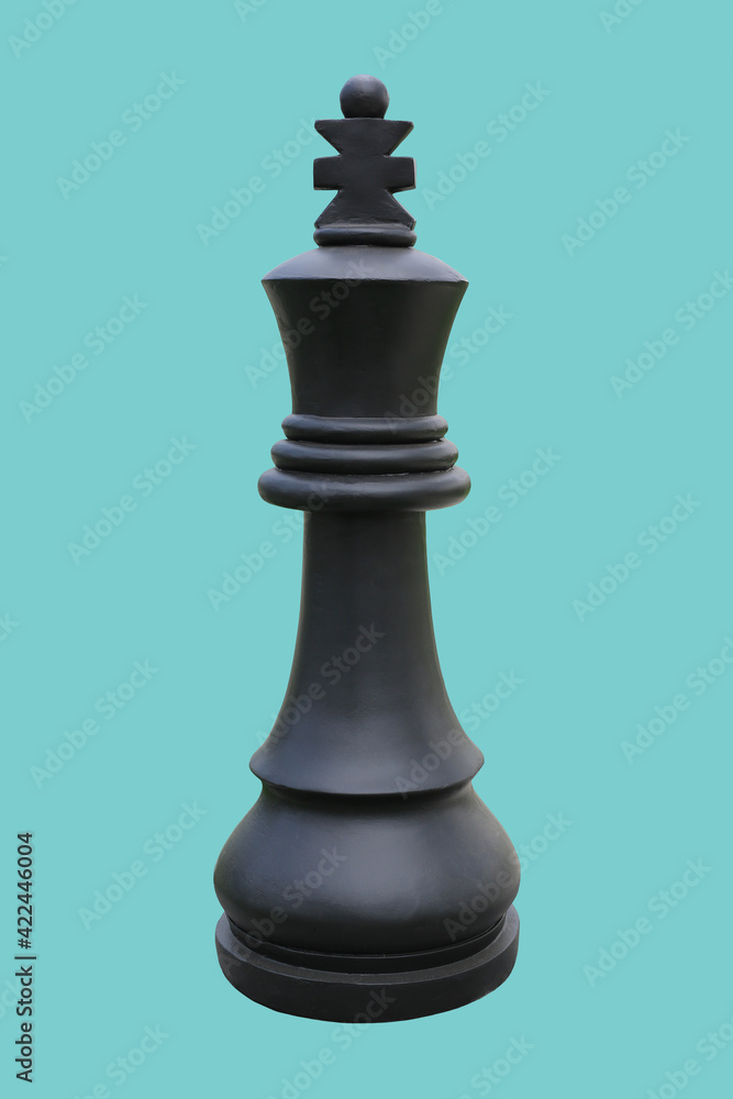 Black chess king standing isolated on cyan background - clipping path Black chess king standing isolated on cyan background - clipping path
