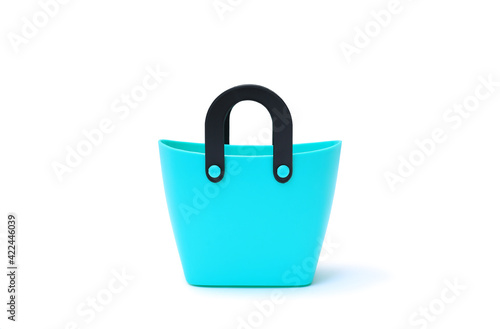 Plastic basket isolated on white background. Cyan shopping bag - clipping path