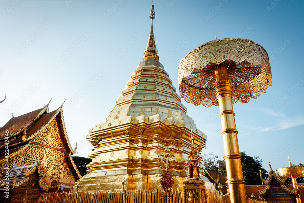 Fototapeta premium Beautiful Majestic Gold Pagoda of Spirituality Worship Place in Thailand. Historical Ancient Temple With Architecture Art of Doi Suthep, Chiang Mai. Thai Cultural and Travel Destination of Thailand.