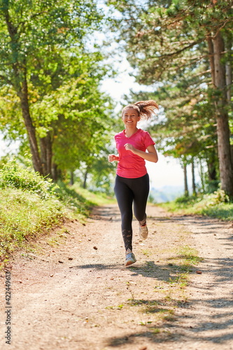 Fototapeta Naklejka Na Ścianę i Meble -  woman enjoying in a healthy lifestyle while jogging