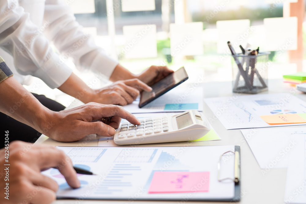 business man financial inspector and secretary making report and brainstorming with colleague in a modern co-working space business man financial inspector and secretary making report and brainstorming with colleague in a modern co-working space