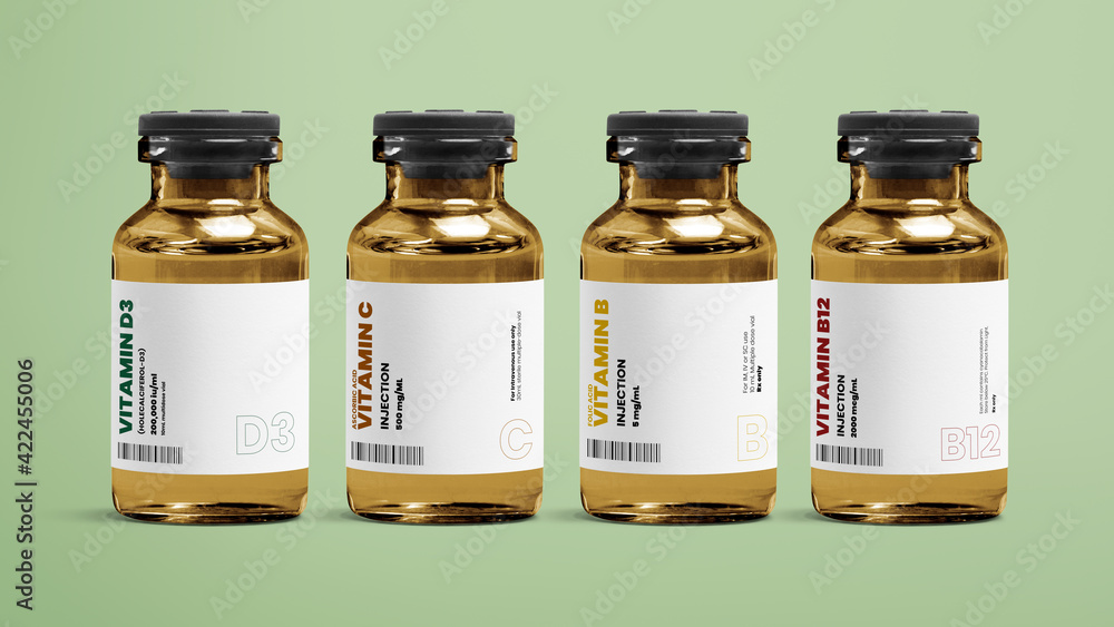 Vitamin injection vial glass bottles on green background - obrazy, fototapety, plakaty 