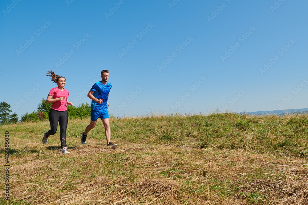 couple jogging in a healthy lifestyle on a fresh mountain air