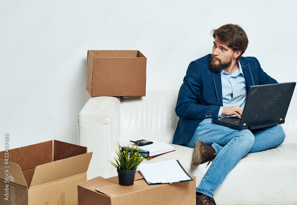 Business man boxes with things laptop work unpacking Professional Business man boxes with things laptop work unpacking Professional