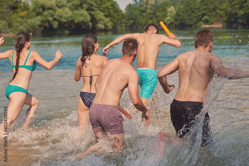 group of happy friends having fun on river group of happy friends having fun on river
