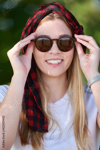 portrait of beautiful, emotional, young woman in sunglasses.