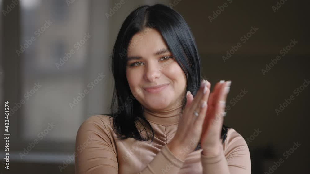 Portrait of beautiful young mexican brazilian girl plump woman plus size brunette looking at camera, applauding clapping her palms, says bravo, expresses delight approval congratulations posing indoor Portrait of beautiful young mexican brazilian girl plump woman plus size brunette looking at camera, applauding clapping her palms, says bravo, expresses delight approval congratulations posing indoor