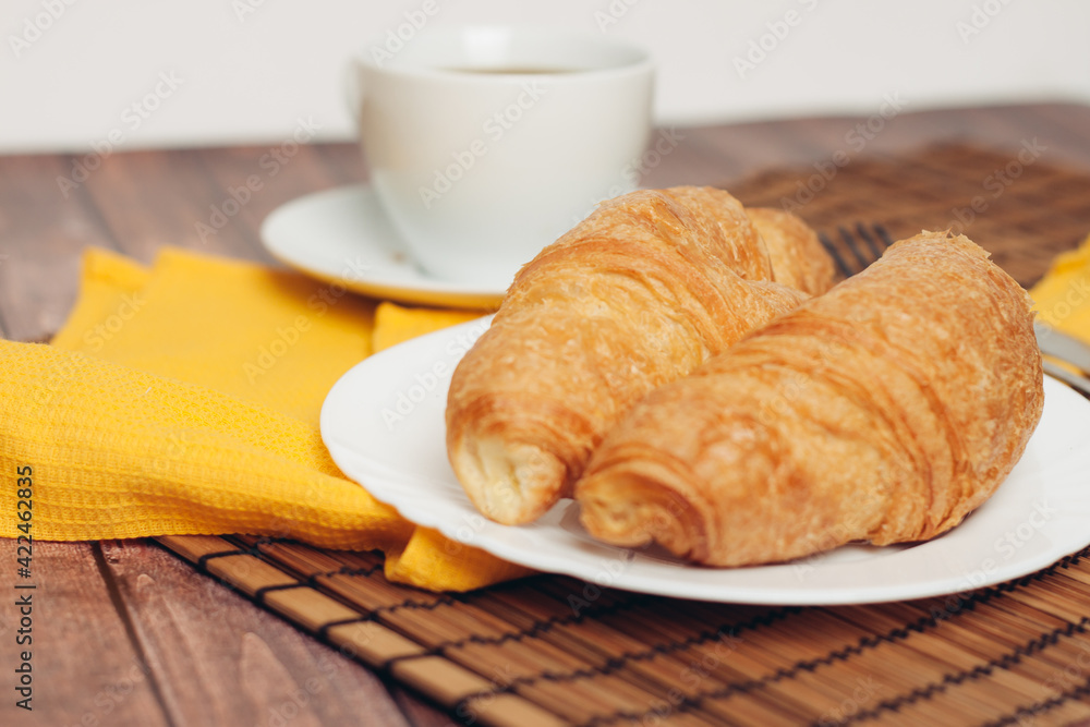 croissant in a plate on the table kitchenware breakfast meal croissant in a plate on the table kitchenware breakfast meal