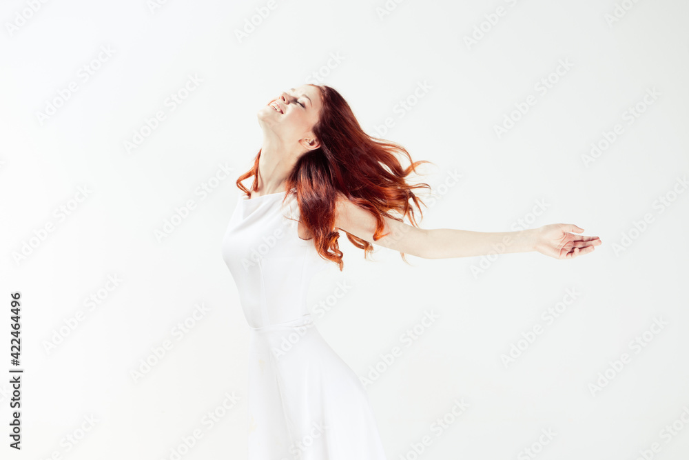 pretty woman white dress dancing light background