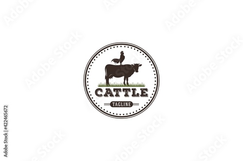 cattle logo with a cow and chicken illustration on it