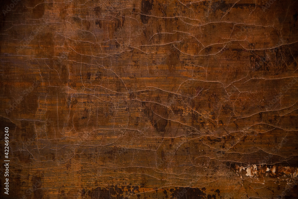 Obraz premium brown, yellow and black colors on a textured, cracked painted surface, background