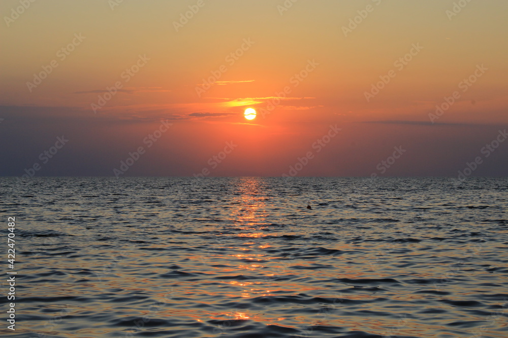 beautiful orange sky at sunset at sea
