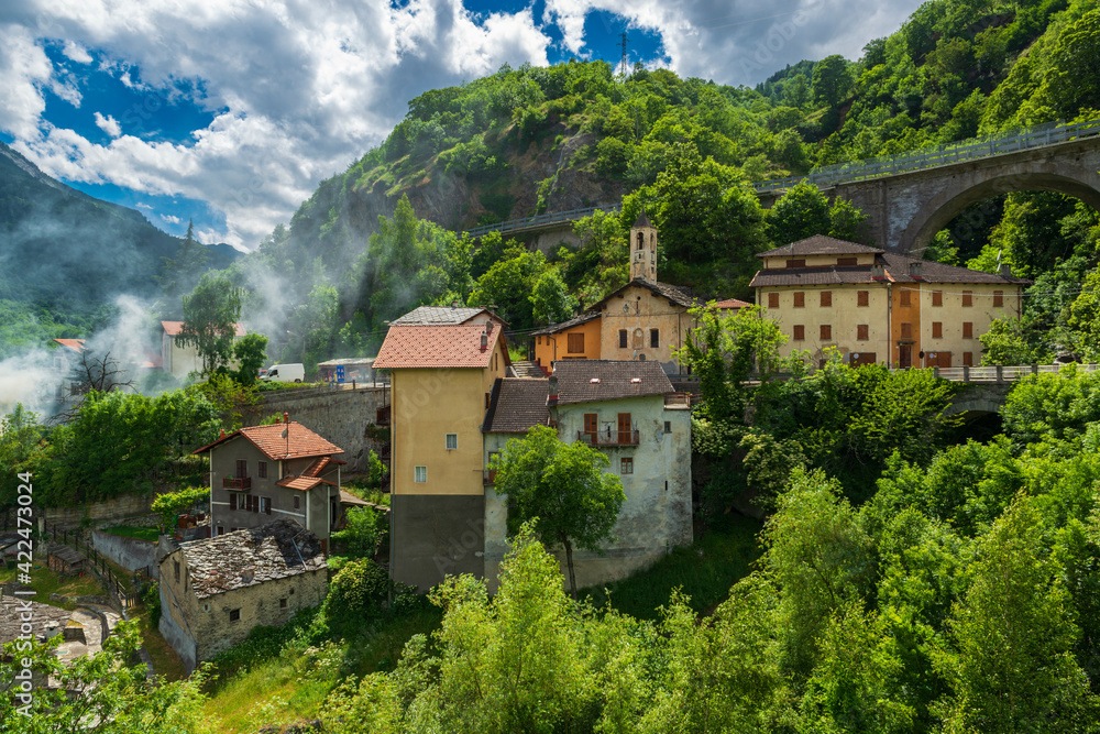 Amazing small alpine town in the narrow mountain valley.