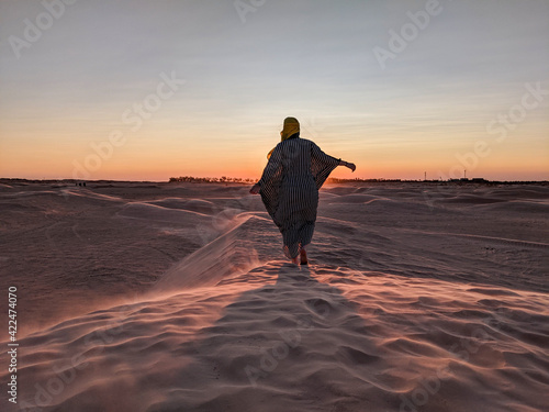 Young girl posing in the desert of Tunisia