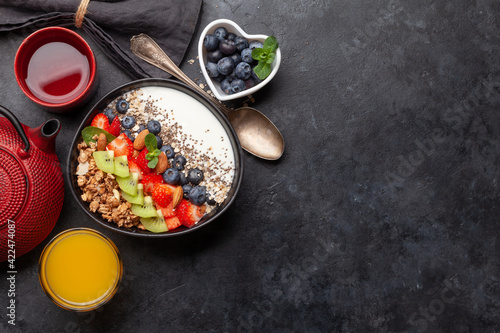 Healthy breakfast with bowl of granola, yogurt and fresh berries