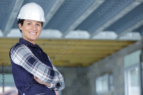 young woman construction worker smiling at camera