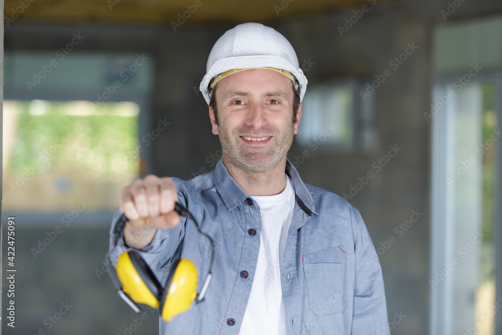 worker showing the importnace of ear protection