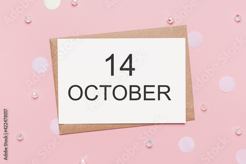 note letter with sparkles on pink background, love and valentine concept with text 14 October
