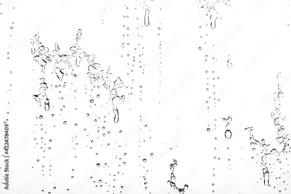 Obraz premium Water Drops Background. Macro view of icy rain drops on the window creating abstract geometric graphic shapes. Close Up