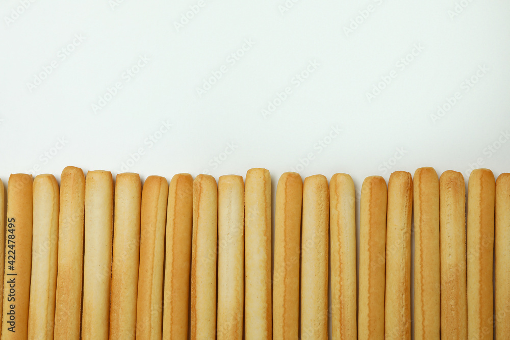 Grissini breadsticks on white background, space for text Grissini breadsticks on white background, space for text