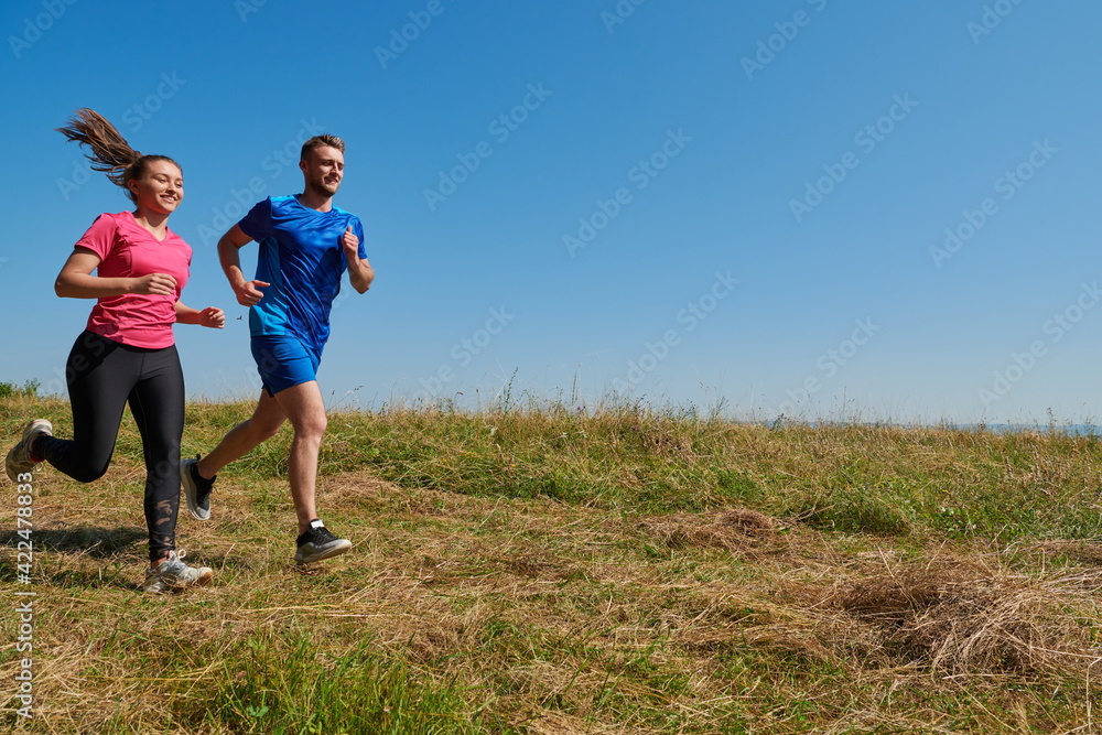 couple jogging in a healthy lifestyle on a fresh mountain air couple jogging in a healthy lifestyle on a fresh mountain air