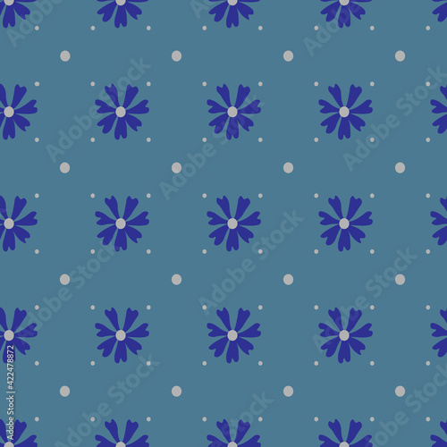 Seamless pattern with blue chamomile, daisies on a light blue background. Summer, minimalistic pattern with flowers. 