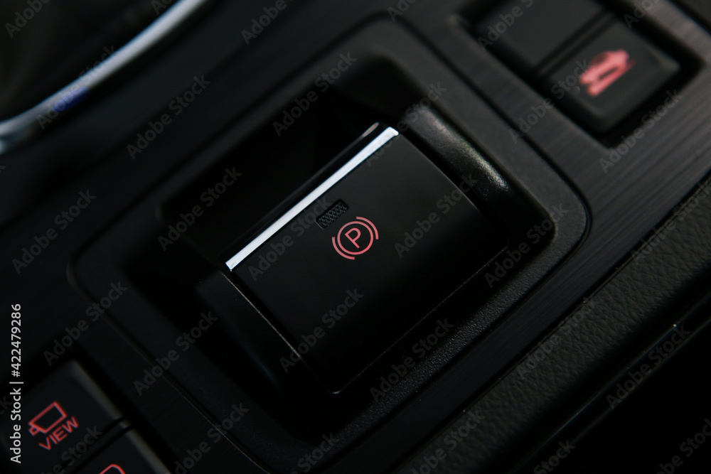 Car brake hold button, car interior. Parkbrake button in auto.