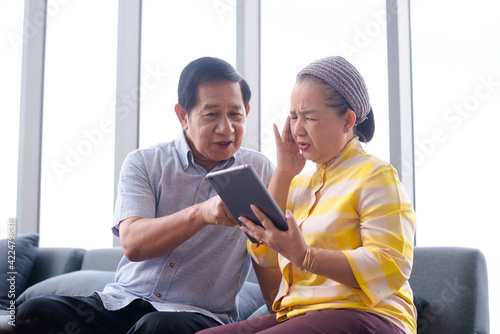asian grandpa help asian grandma learn to use smart divice connect with her family