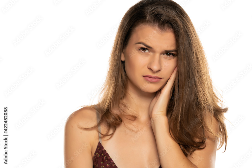 Young woman with a toothache, isolated on white. Young woman with a toothache, isolated on white.