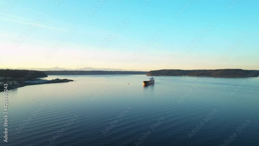 Boat Cruising Through Dune Penninsula Bay In Ruston Way Tacoma Washington - aerial shot Boat Cruising Through Dune Penninsula Bay In Ruston Way Tacoma Washington - aerial shot