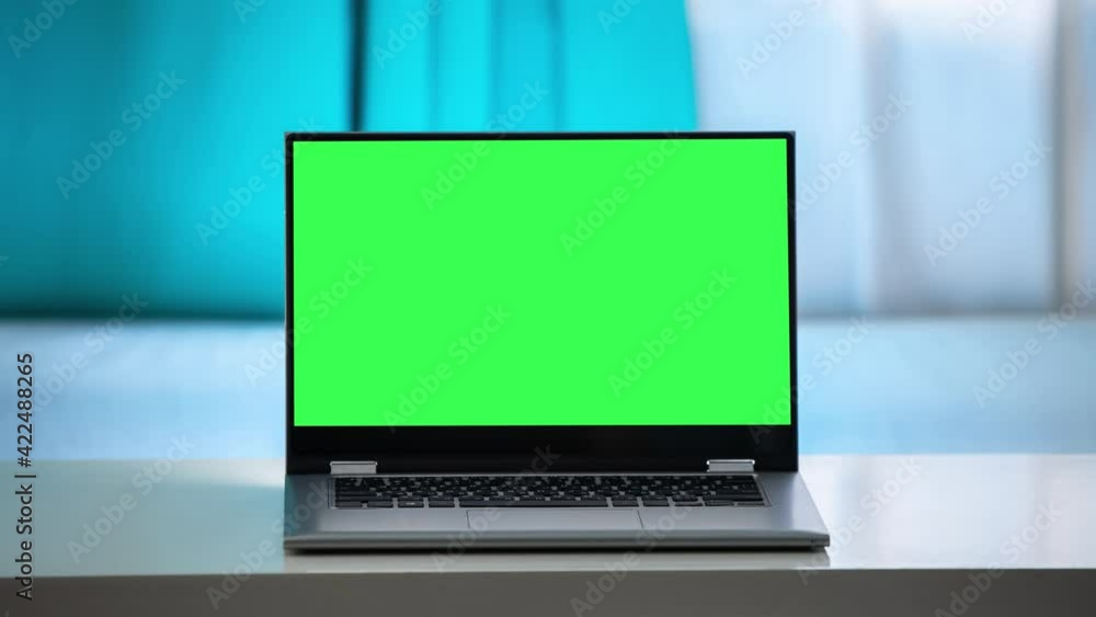 Working in the evening. Laptop with green screen. Zoom in. Template for keying Working in the evening. Laptop with green screen. Zoom in. Template for keying