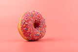 Fresh made Donuts isolated on pink background. Doughnuts are traditional sweet pastries. Copy space for text.