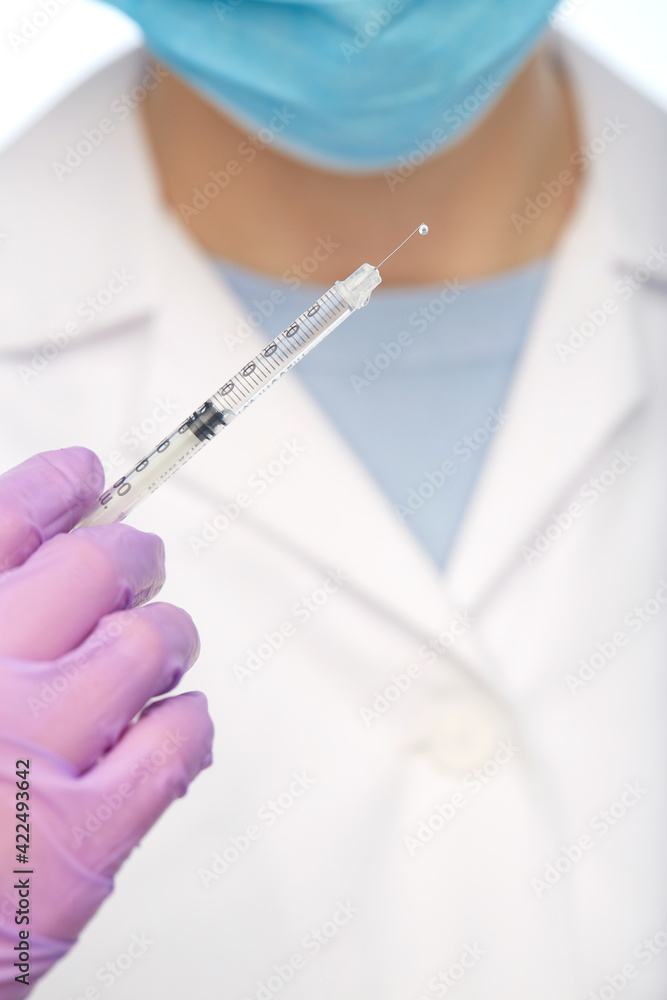 close up of doctor with syringe close up of doctor with syringe