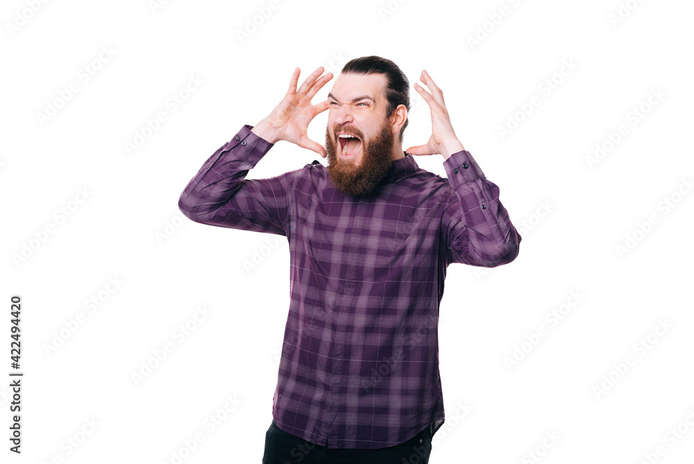 Photo of angry frustrated young bearded man gesturing Photo of angry frustrated young bearded man gesturing