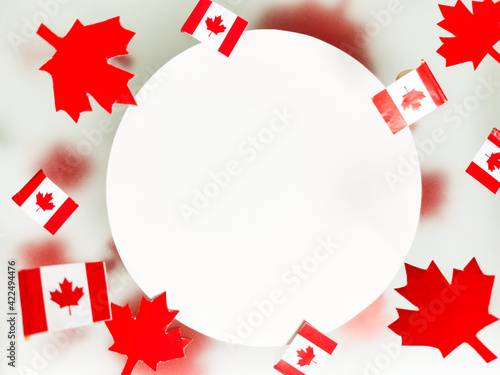 July 1, Happy Canada Day. Red maple leaves, flags and a white postcard on a transparent foggy background. The concept of freedom and patriotism, independence and victory. Mockup. Copy space