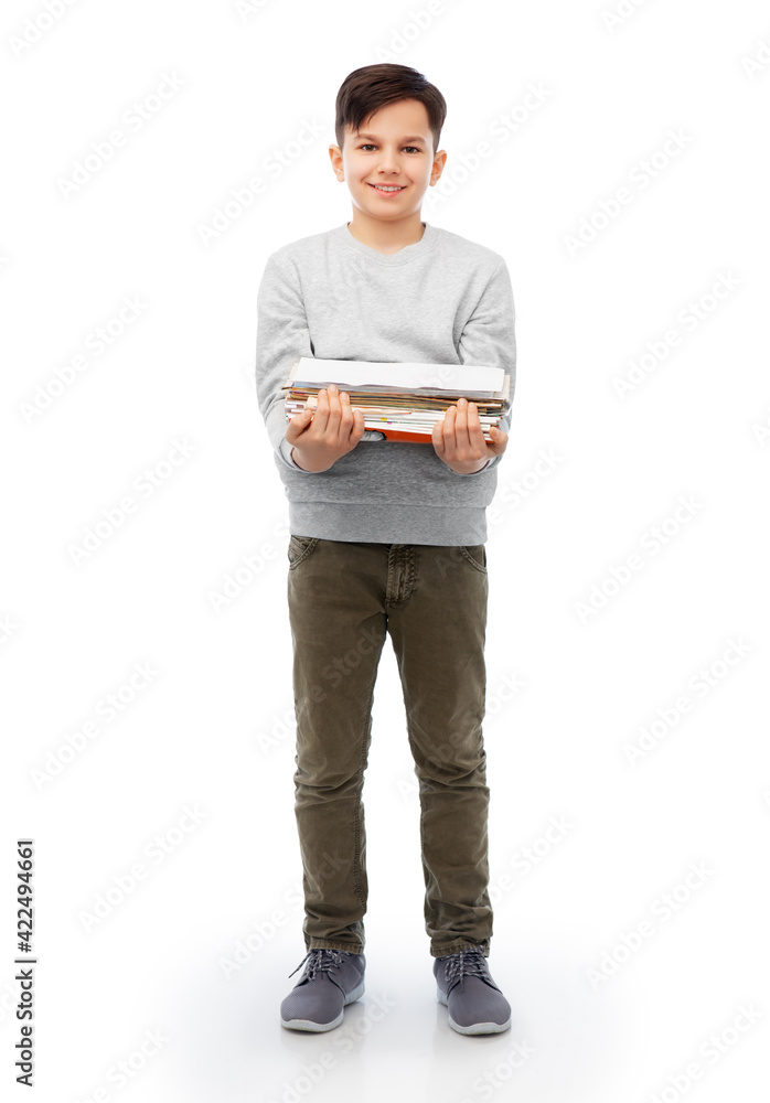 smiling boy with magazines sorting paper waste smiling boy with magazines sorting paper waste
