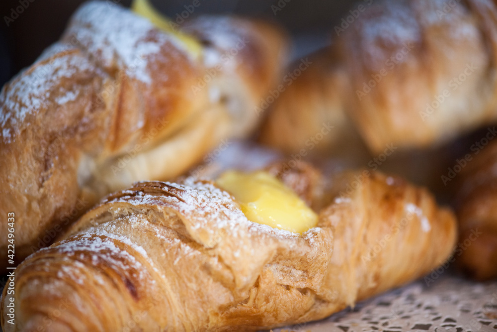 Freshly baked croissants on a plate with different fillings. Freshly baked croissants on a plate with different fillings.