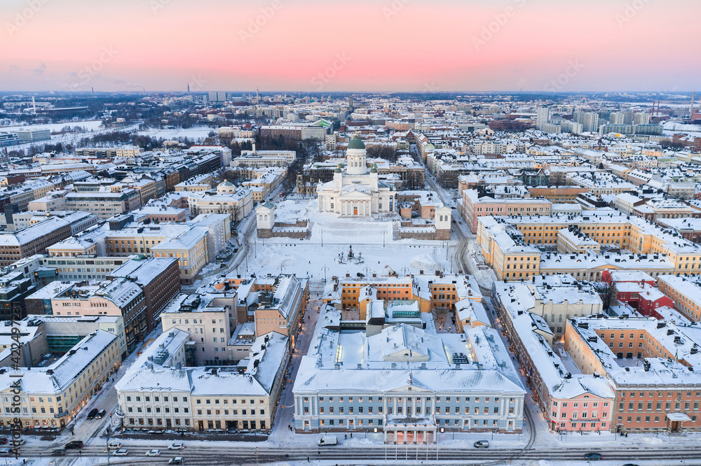 Aerial view of Kruununhaka Central neighborhood of Helsinki, Finland. View of Helsinki City Hall, Helsinki Cathedral, Senate Square, and over places. Winter cityscape.