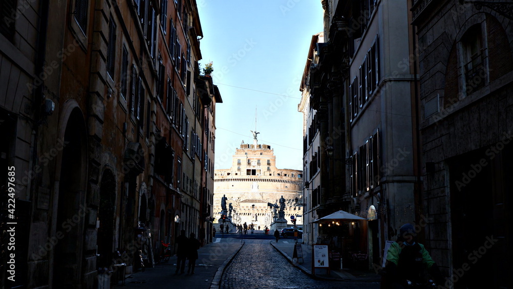 View on famous Saint Angel castle and bridge over the Tiber river in Rome, Italy.