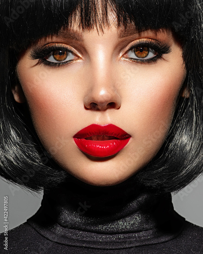 Fotobehang Beautiful brunette girl with red lips and black bob hairstyle