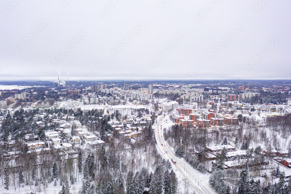 Aerial view of Matinkyla neighborhood of Espoo, Finland. Snow-covered city in winter.