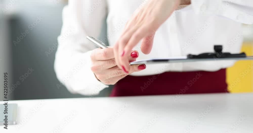Woman giving pen and document on clipboard for signature 4k movie Woman giving pen and document on clipboard for signature 4k movie