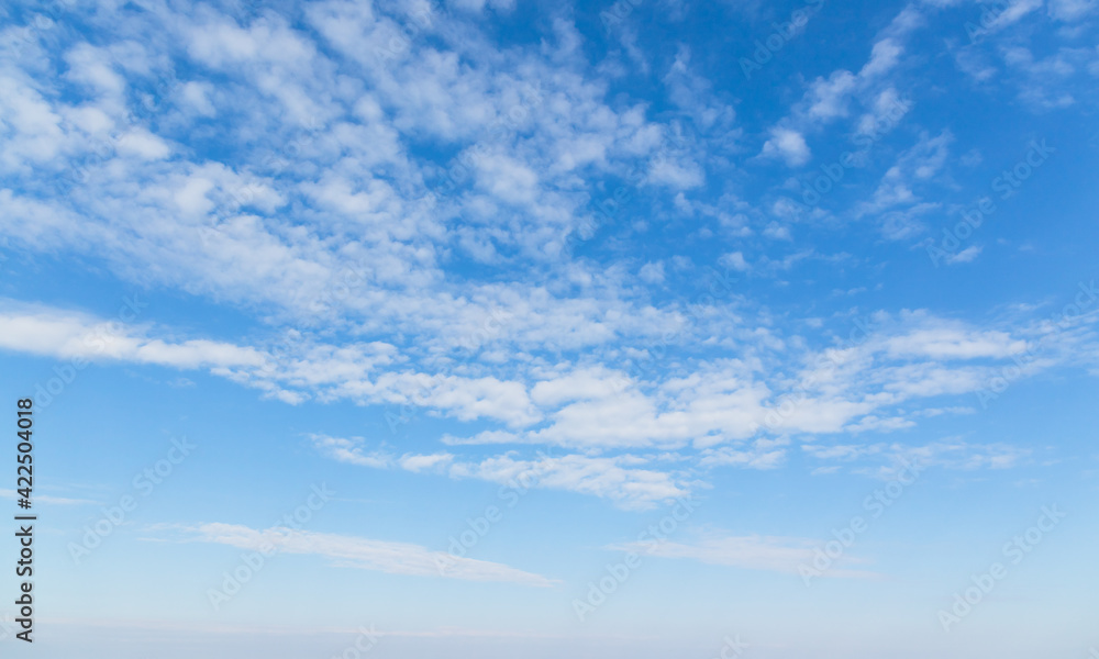 Fototapeta premium Blue sky with white altocumulus clouds on a daytime
