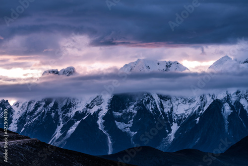Snow-capped mountains and morning fire clouds © Bob
