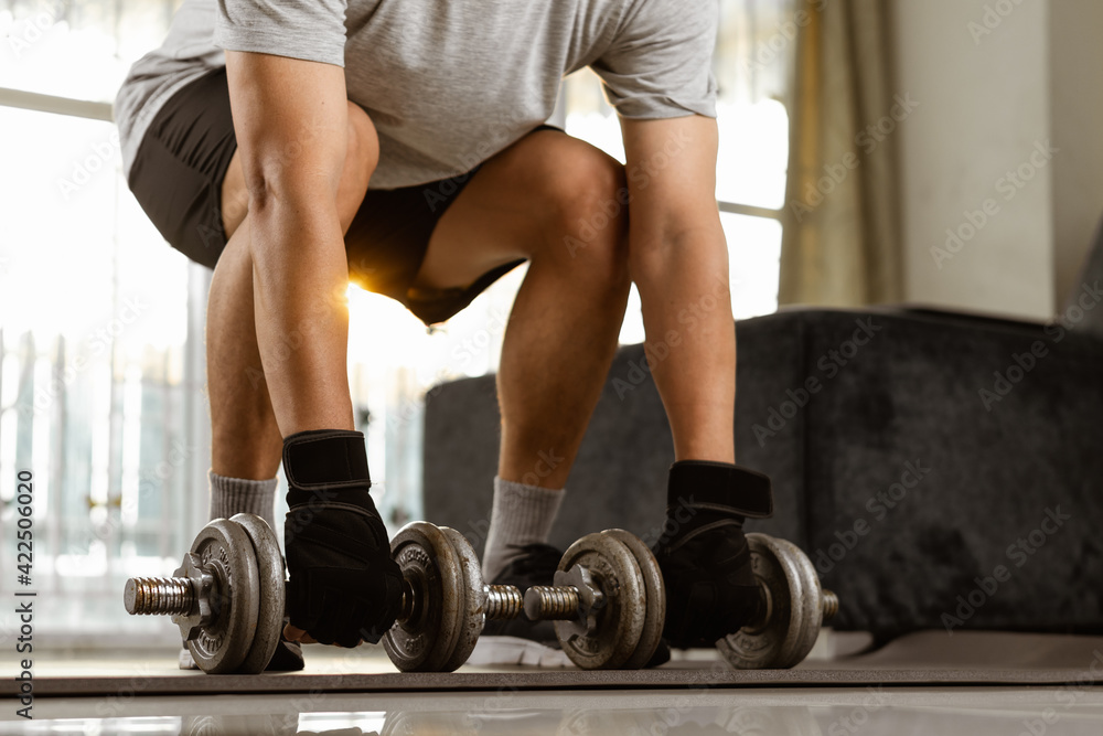Sport man prepare doing dumbbell exercise workout in home. Sport man prepare doing dumbbell exercise workout in home.
