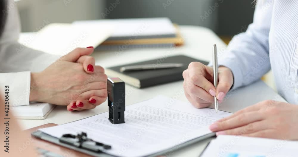 Woman signing document and putting stamp in office 4k movie Woman signing document and putting stamp in office 4k movie