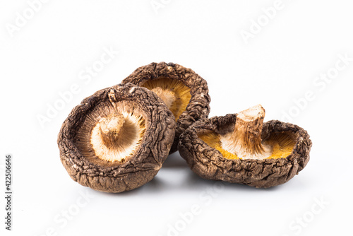 Close-up of dried shiitake mushrooms isolated on white background. photo