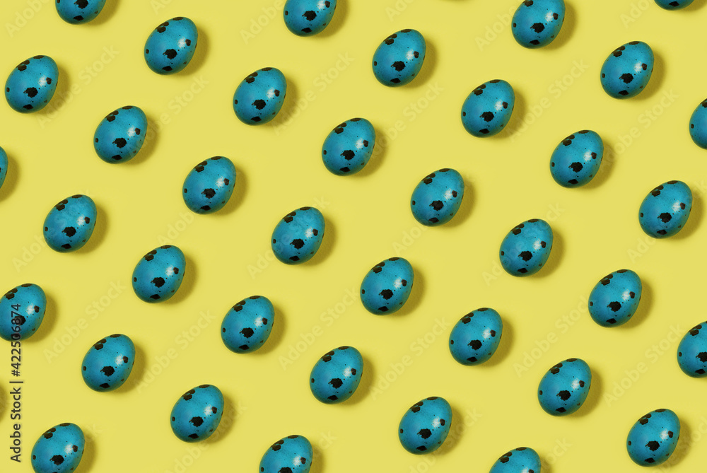 Pattern of colored Easter eggs in green on an yellow background. Minimal easter concept. Easter spring holiday background. Pattern of colored Easter eggs in green on an yellow background. Minimal easter concept. Easter spring holiday background.